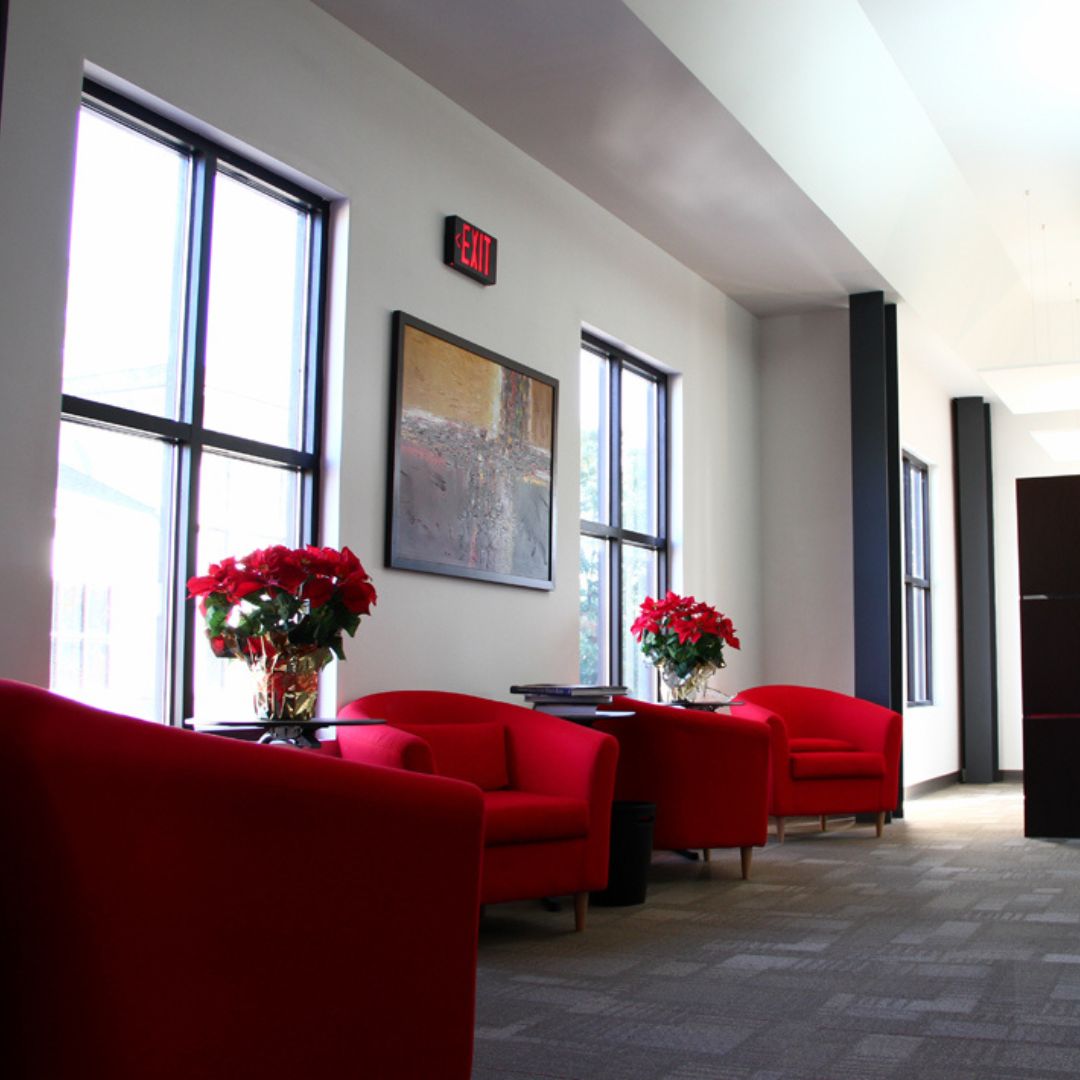 A commercial interior featuring bright red seating